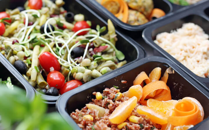 Food containers filled with various foods