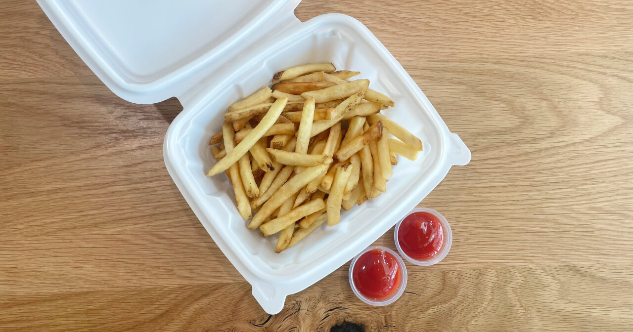 A sustainable food container made from Verde bioresins' material filled with french fries