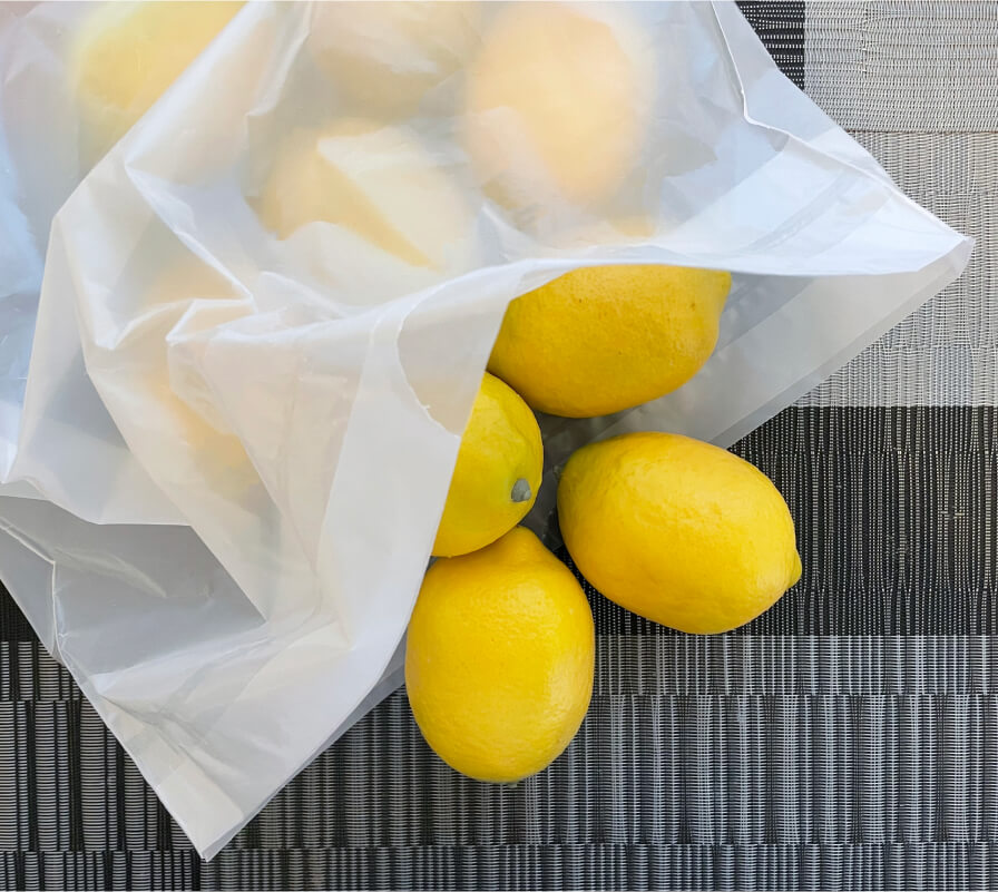 A sustainable bag filled with lemons